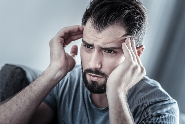 Exhausted bearded male person looking forward - Photo, Image