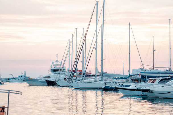 yacht bay on amazing backgrount with city and mountains at sunset. - Zdjęcie, obraz