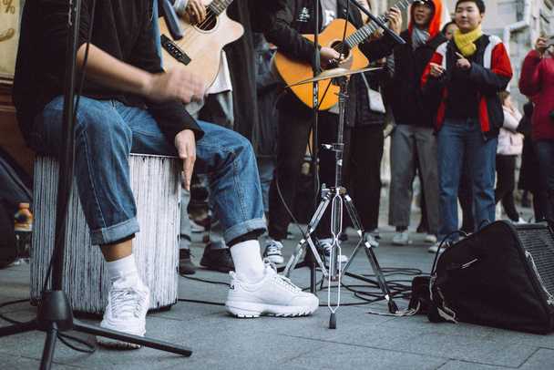  street musician on street in  town - Фото, изображение