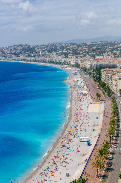 View of buildings and beaches next to blue sea in the city of Nice, France - Photo, Image