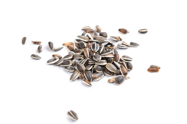 sunflower seed in heap on white background in studio - Photo, Image