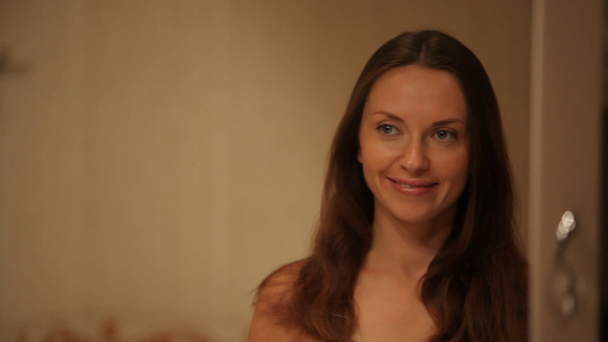 Young beautiful woman cares for her face - Metraje, vídeo