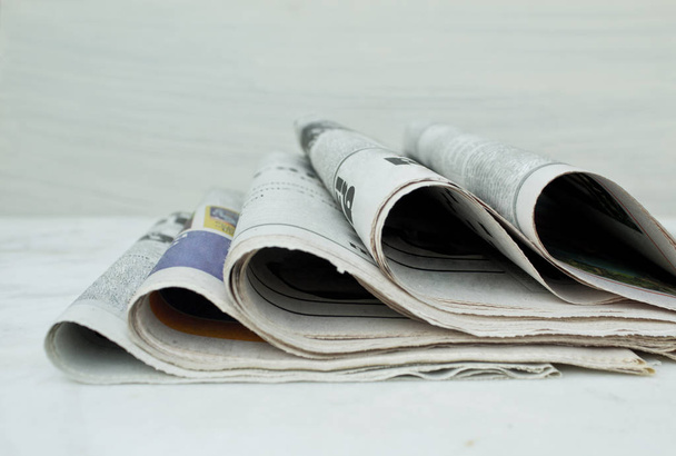 Stack of newspapers on white background. - Foto, Imagem