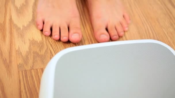 Feet in Close-up on Weighing Scales - Footage, Video