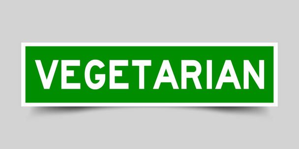 Square green sticker label in word vegetarian on gray background - Vector, Image