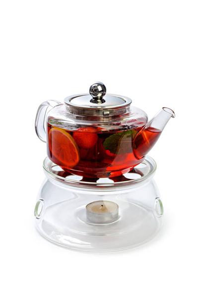 Glass teapot with fruit slices isolated on white background - Foto, Bild