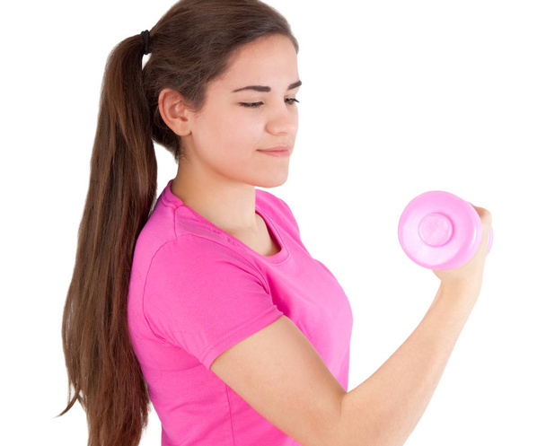 beautiful young woman with dumbbell - Zdjęcie, obraz