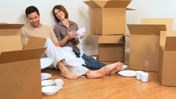 Caucasian Couple Surrounded by Moving Boxes - Footage, Video