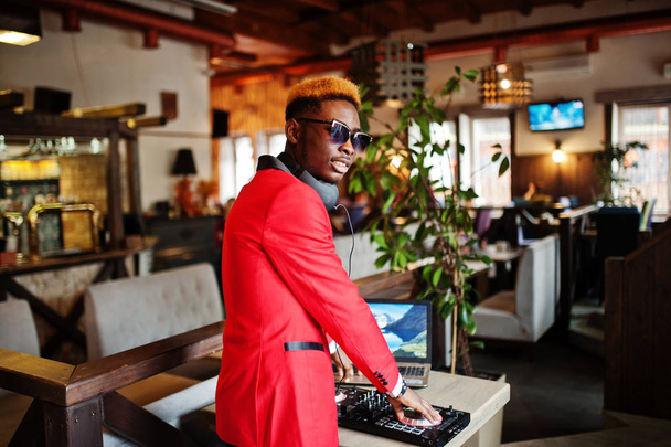 Fashion african american man model DJ at red suit with dj controller.  - Foto, Imagem