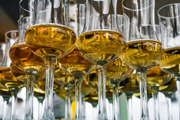 Dear Scotch whiskey in branded glasses on a high leg. Presentation of new whiskeys - Foto, imagen