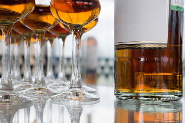Dear Scotch whiskey in branded glasses on a high leg. Presentation of new whiskeys - Fotó, kép