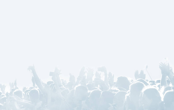 Crowd of spectators at a concert in light blue tonality. High key background with a people on an open playground at a concert. Abstract soft focus image with copy space - Photo, Image