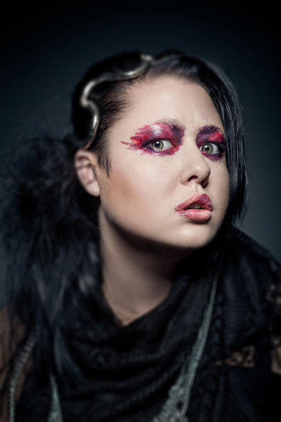 portrait of young brunette woman with fashion makeup on dark bac - Foto, Imagen