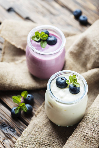 Homemade yogurt with blueberry and mint, selective focus - Fotó, kép