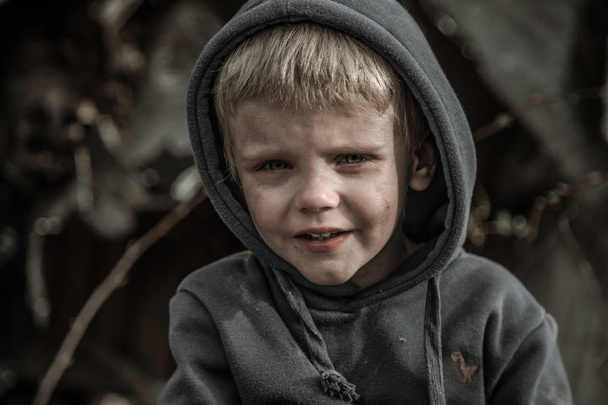 sad homeless boy in abandoned village - Fotografie, Obrázek