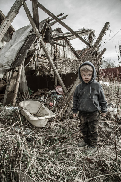 sad homeless boy in abandoned village - Φωτογραφία, εικόνα