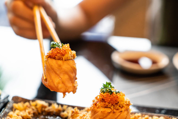 salmon sushi rolls with sauce - japanese food style - Photo, image