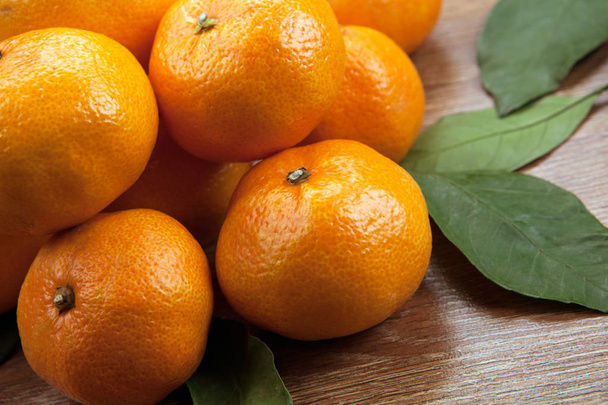 bunch of fresh tangerines or mandarins close up - Фото, изображение