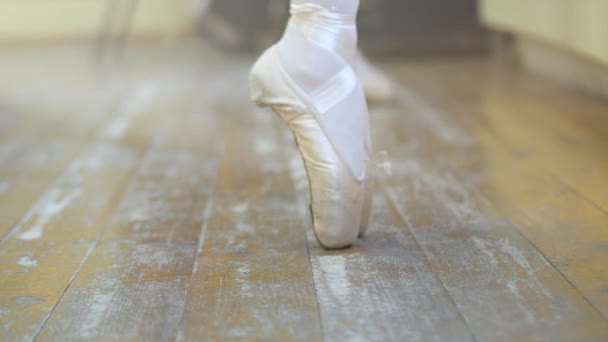 Ballet.Close-up of a girls legs in white ballet shoes during ballet training. Element of classical dance. 4K - Πλάνα, βίντεο