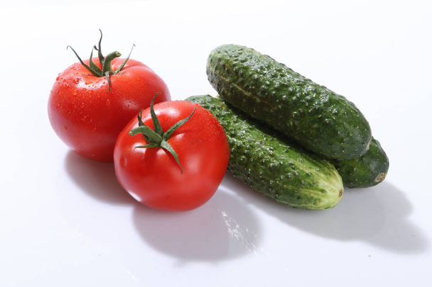 Vegetables, tomatoes and cucumbers fresh. - Photo, Image