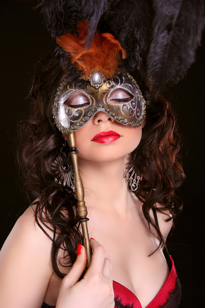 Masquerade. Sexy woman with Carnival mask on face - Foto, imagen