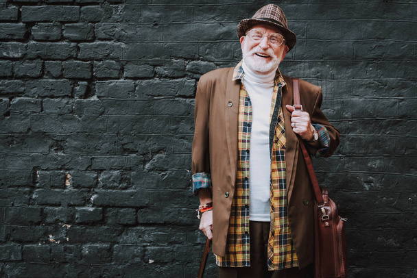 Stylish elderly man posing in fashionable clothes - Foto, imagen