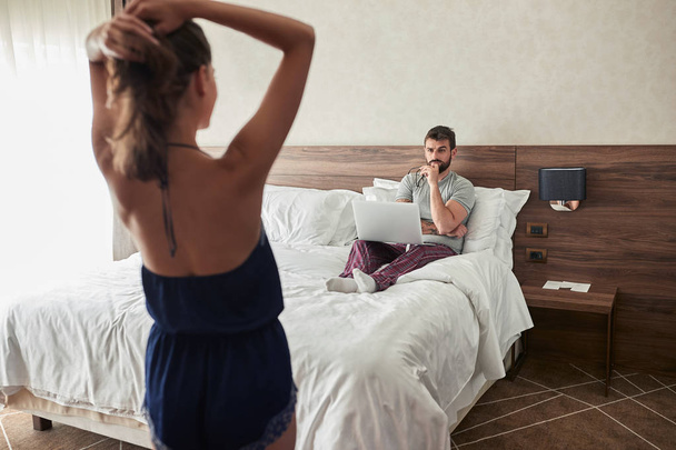 sexy romantic woman seduces her men in the bedroom - Фото, изображение