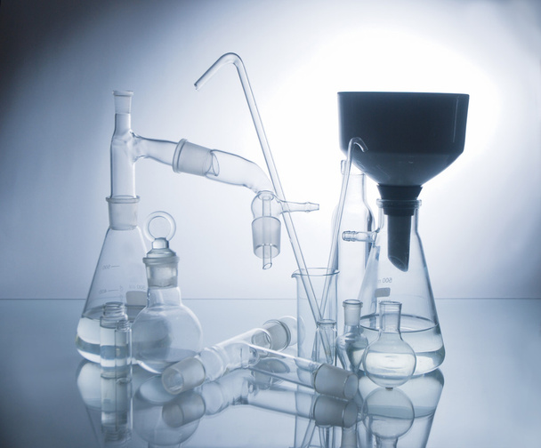 Laboratory glassware over white - Foto, afbeelding