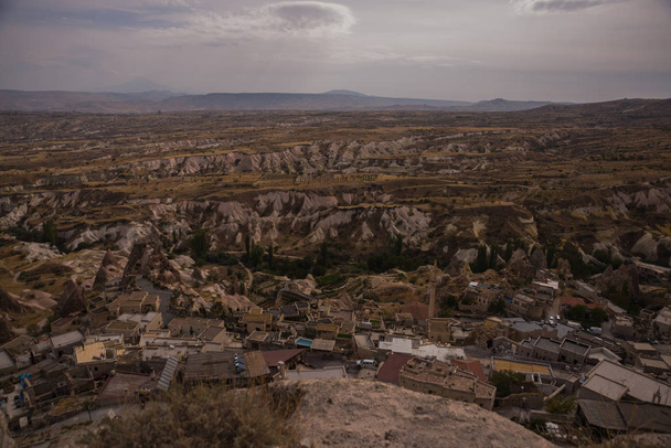 Panorama of the Uchisar fortress in the Cappadocia region. Beautiful landscape of Asian city with cave houses. Cappadocia, Turkey. - Photo, Image