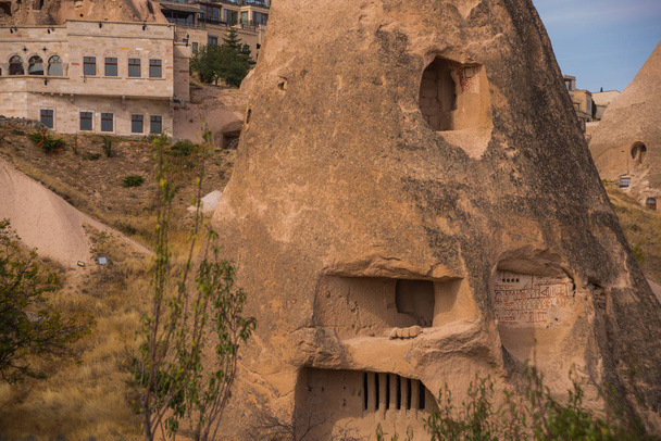 Uchisar castle in Cappadocia, Turkey., Nevsehir province. Cave houses in cones sand hills. Landscape photography - Photo, Image