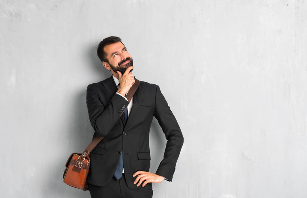 Businessman with beard standing and thinking an idea - Foto, Imagem