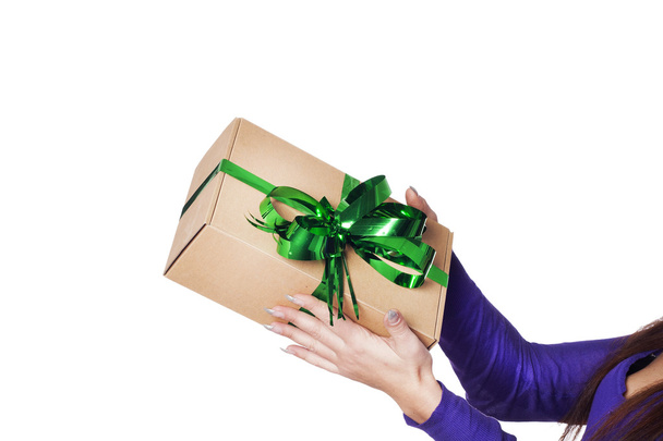 Hands giving a present over isolated background - Photo, image