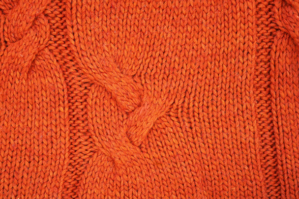 Oranžová pletená textura s reliéfním vzorem. Ručně pletené. Pozadí, abstraktní. - Fotografie, Obrázek