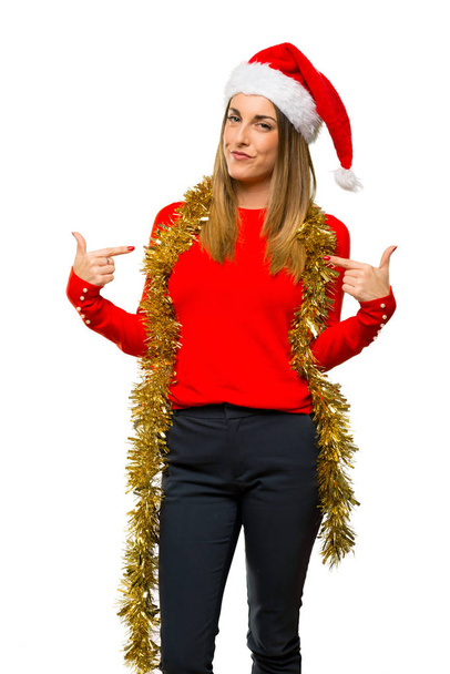 Blonde woman dressed up for christmas holidays proud and self-satisfied in love yourself concept on isolated white background - Photo, Image