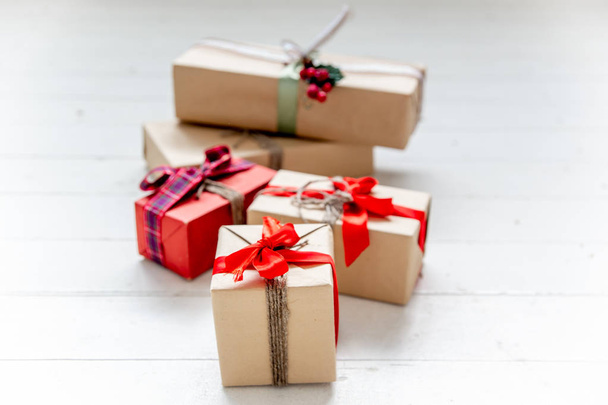 Christmas presents and boxes on wooden background - Φωτογραφία, εικόνα