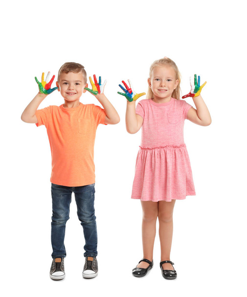 Little children with painted hands on white background - Foto, Imagen