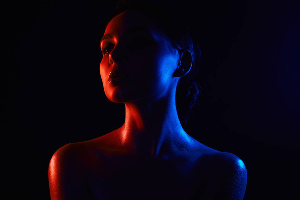 Beauty Rainbow woman silhouette. Beautiful Girl in color bright lights - Foto, Imagem
