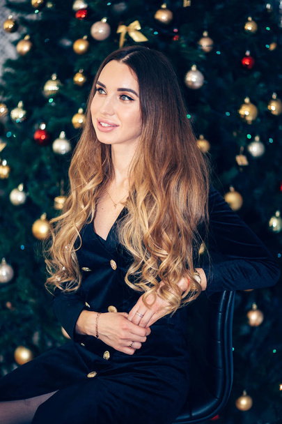 Christmas, fashion concept. Beautiful charming woman in evening dress with a smile, looking to the side. Holiday, New year, happiness concept - Φωτογραφία, εικόνα