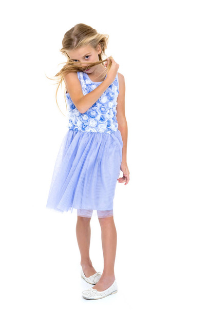 Little girl in a dress developing in the wind. - Fotoğraf, Görsel