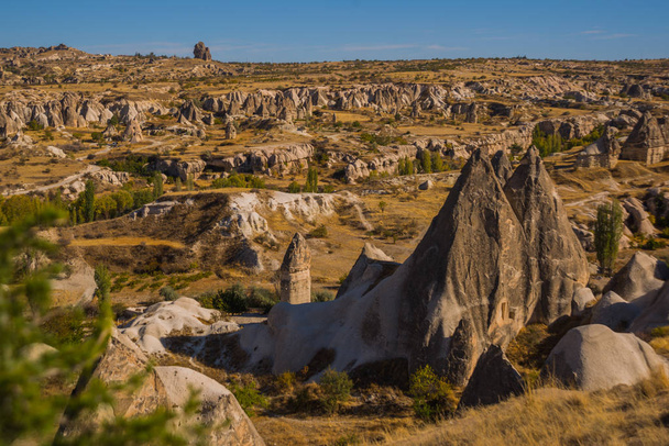 Beautiful landscape with mountains and unusual rock formations. Top view from the observation deck Goreme. Cappadocia, Goreme, Anatolia, Turkey. - Foto, afbeelding