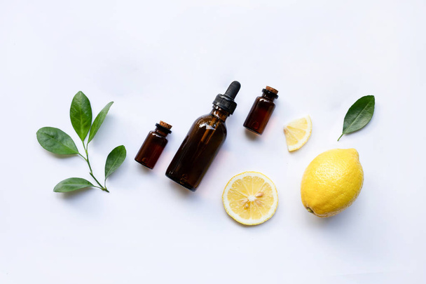 Fresh lemon with lemon essential oil on a white background. - Fotó, kép