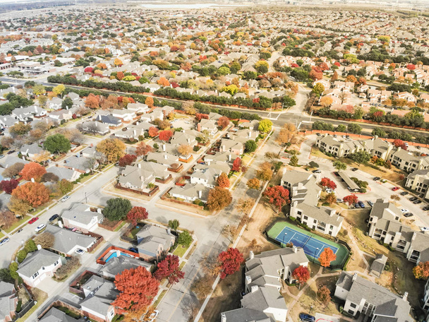 Aerial view Valley Ranch planned unit development with community tennis court in Dallas suburb of Irving, Texas, USA. Colorful fall foliage leaves, row of single-family homes, urban sprawl subdivision - Photo, Image