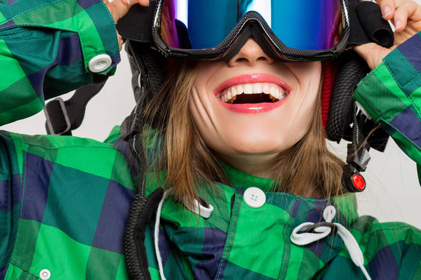 portrait of a snowboarder in ski goggles isolated on white - 写真・画像