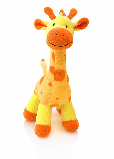 Giraffe plushie doll isolated on white background with shadow reflection. Giraffe plush stuffed puppet on white backdrop. Colored stuffed giraffe toy. Yellow giraffe. - Photo, Image