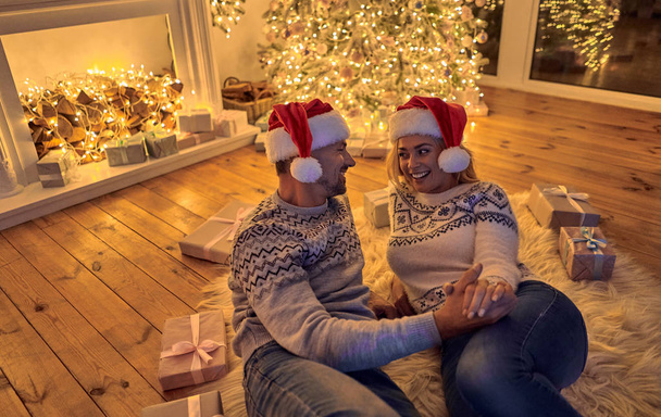 Merry Christmas and Happy New Year! Romantic couple celebrating winter holiday at home together. - Φωτογραφία, εικόνα