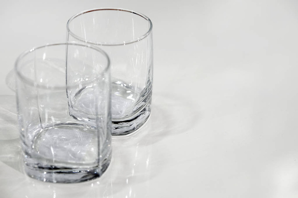 two empty glasses. close-up view from above. the empty surface of the table. - Foto, Bild