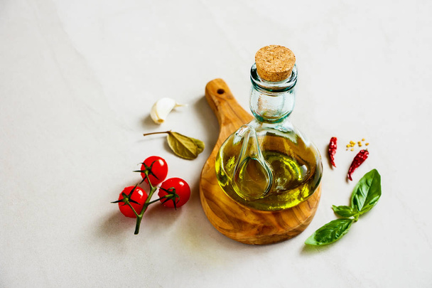Olive oil and healthy seasonal ingredients close up - Фото, зображення