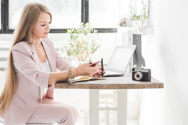 Young business woman working at home. Creative Scandinavian style workspace - Photo, image
