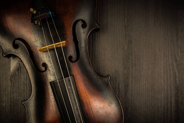 Detail of old violin in vintage style on wood background - Φωτογραφία, εικόνα