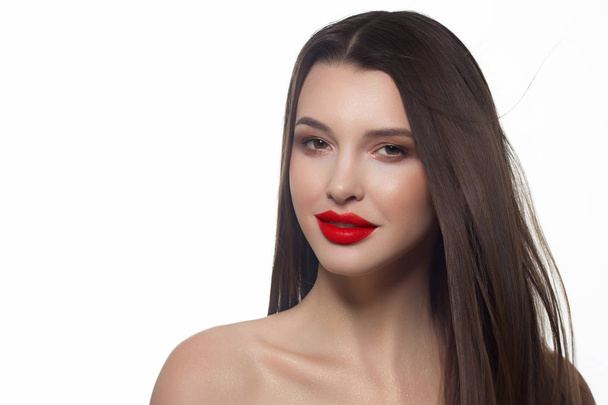 Close-up portrait of sexy european young woman model with classic glamour make-up and red lipstick. Dark long hairstyle, christmas makeup, dark eyeshadows, bloody red lips with gloss - Zdjęcie, obraz